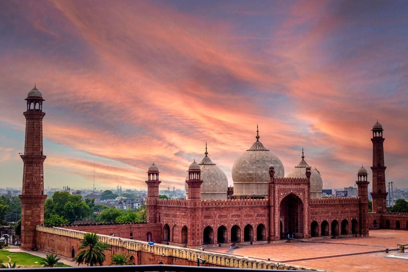 Badshahi Mosque in Lahore under a dramatic sunset